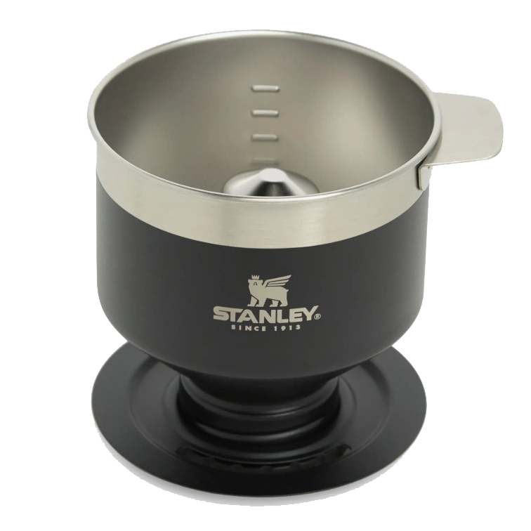 Stanley Classic Pour Over is a stainless steel coffee dripper with a sleek black exterior, designed for manual brewing. It features a sturdy handle and graduated markings inside for precise brewing.