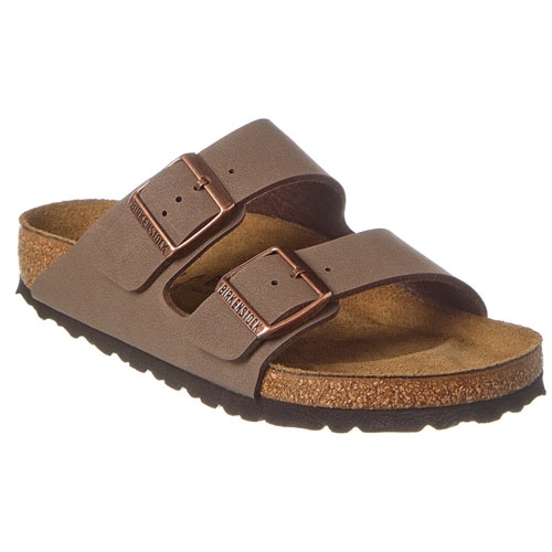 A pair of brown double-strap sandals with metal buckles and cork footbeds.