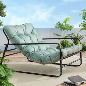 A comfortable outdoor lounge chair with a metal frame and cushioned seat, surrounded by potted plants on a wooden deck.