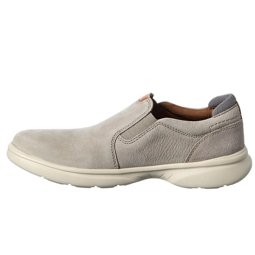 A slip-on men's shoe in light gray with a textured upper, featuring a cushioned sole and subtle stitching details.