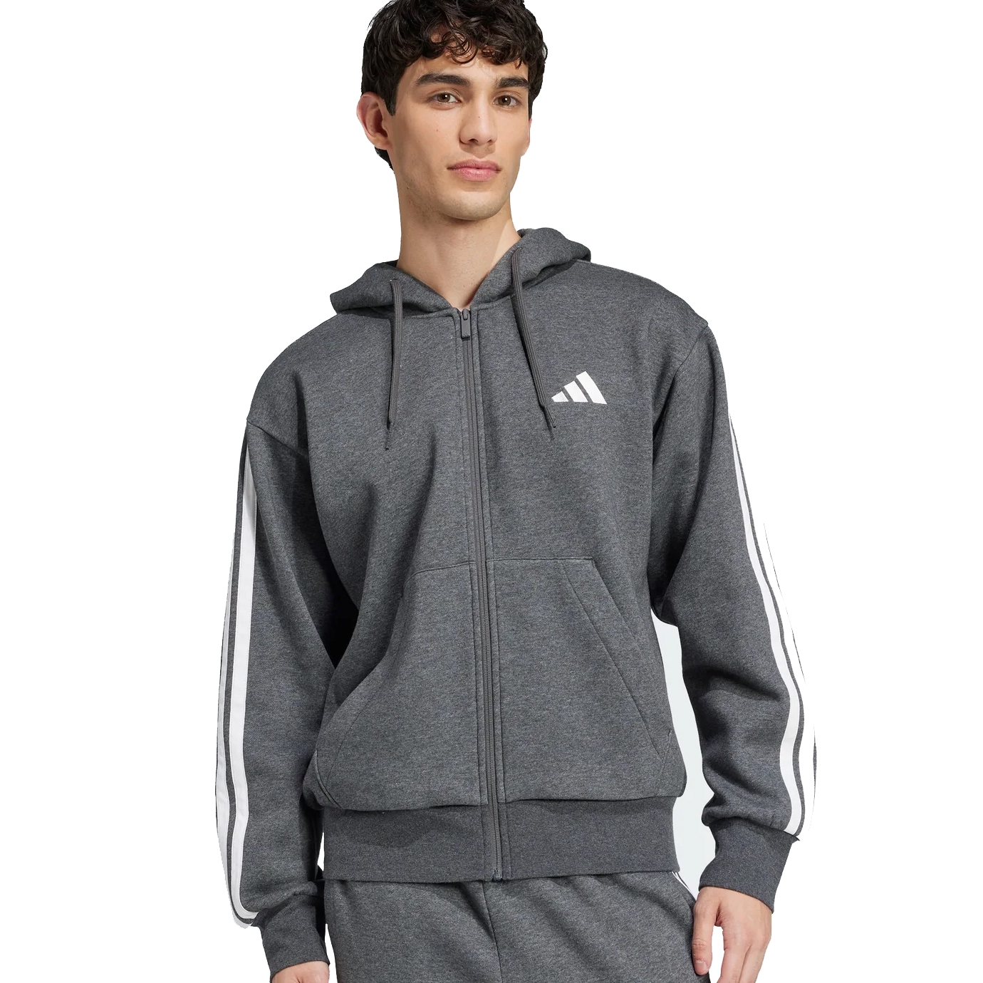 A person is wearing a gray Adidas zip-up hoodie with white stripes on the sleeves, featuring the Adidas logo on the chest.