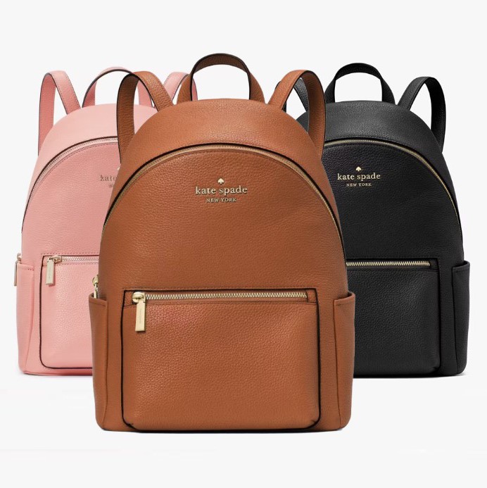 Three leather backpacks in pink, tan, and black, each with a front zipper pocket and adjustable shoulder straps.