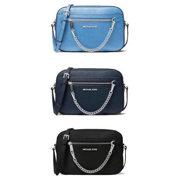 Three Michael Kors crossbody bags in light blue, navy blue, and black, each with chain-link accents and adjustable straps.