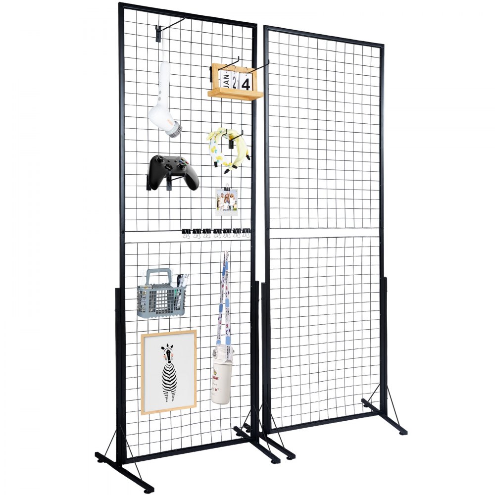 2-pack VEVOR Grid Wall Panels, each with a black metal wireframe design, featuring a variety of hanging items such as a light bulb, game controller, clipboard, and picture frame. Panels are freestanding with sturdy metal bases.
