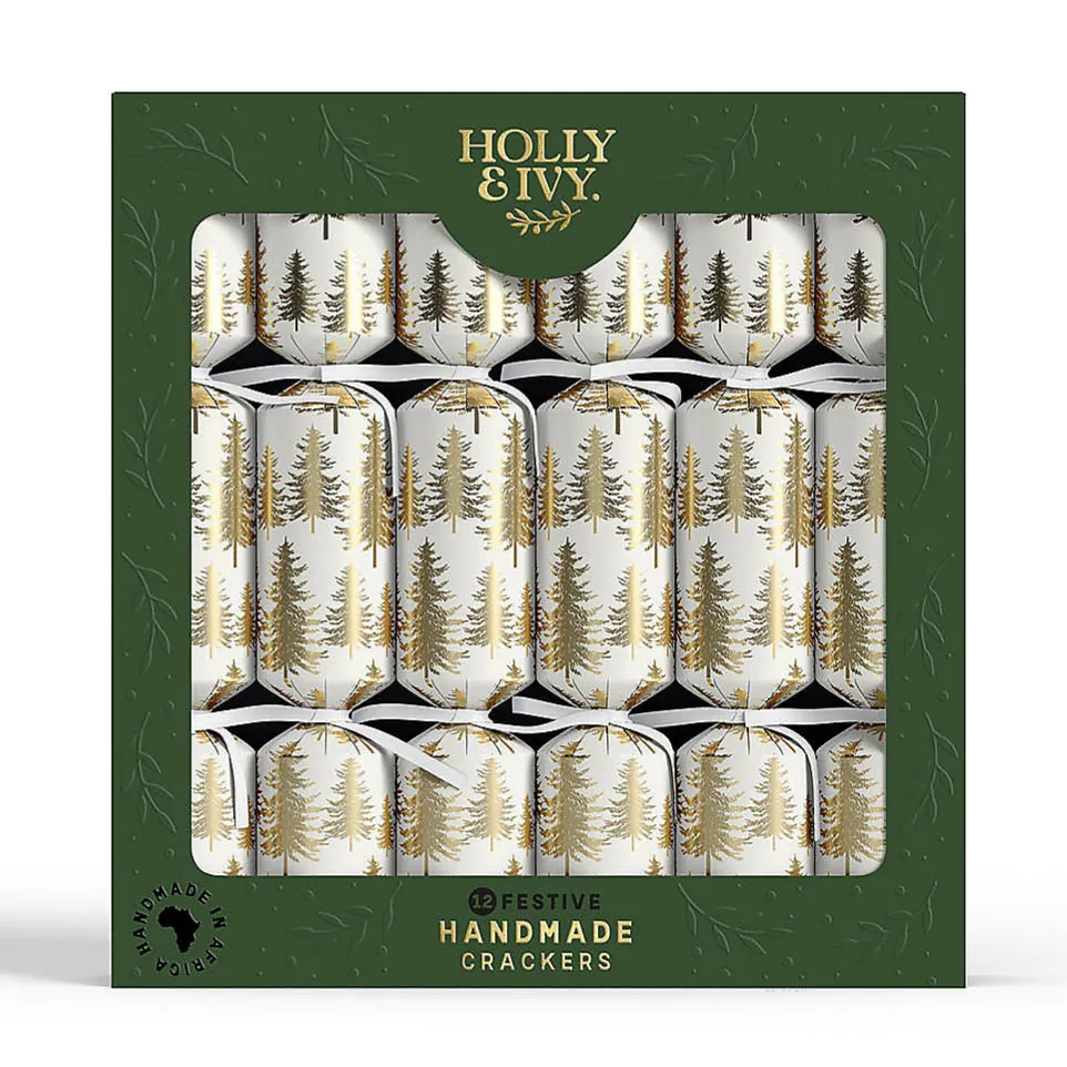 Box of festive handmade crackers by Holly & Ivy, featuring a design with gold trees on a white background.