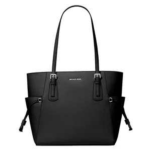 A black Michael Kors tote bag with dual handles and a structured design, featuring the brand's logo on the front.