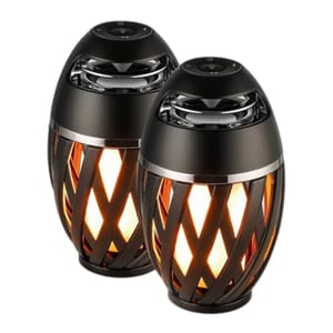 A pair of Bluetooth tiki torch speakers with a black criss-cross design that emits warm light, resembling a flame. They feature controls on top and can be used for ambient lighting and audio outdoors.