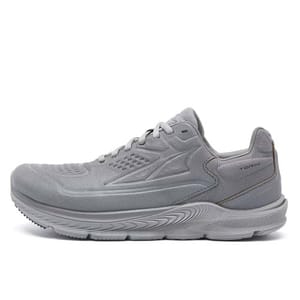 A gray athletic shoe with a sleek design and textured upper, featuring a cushioned sole and lace-up closure.
