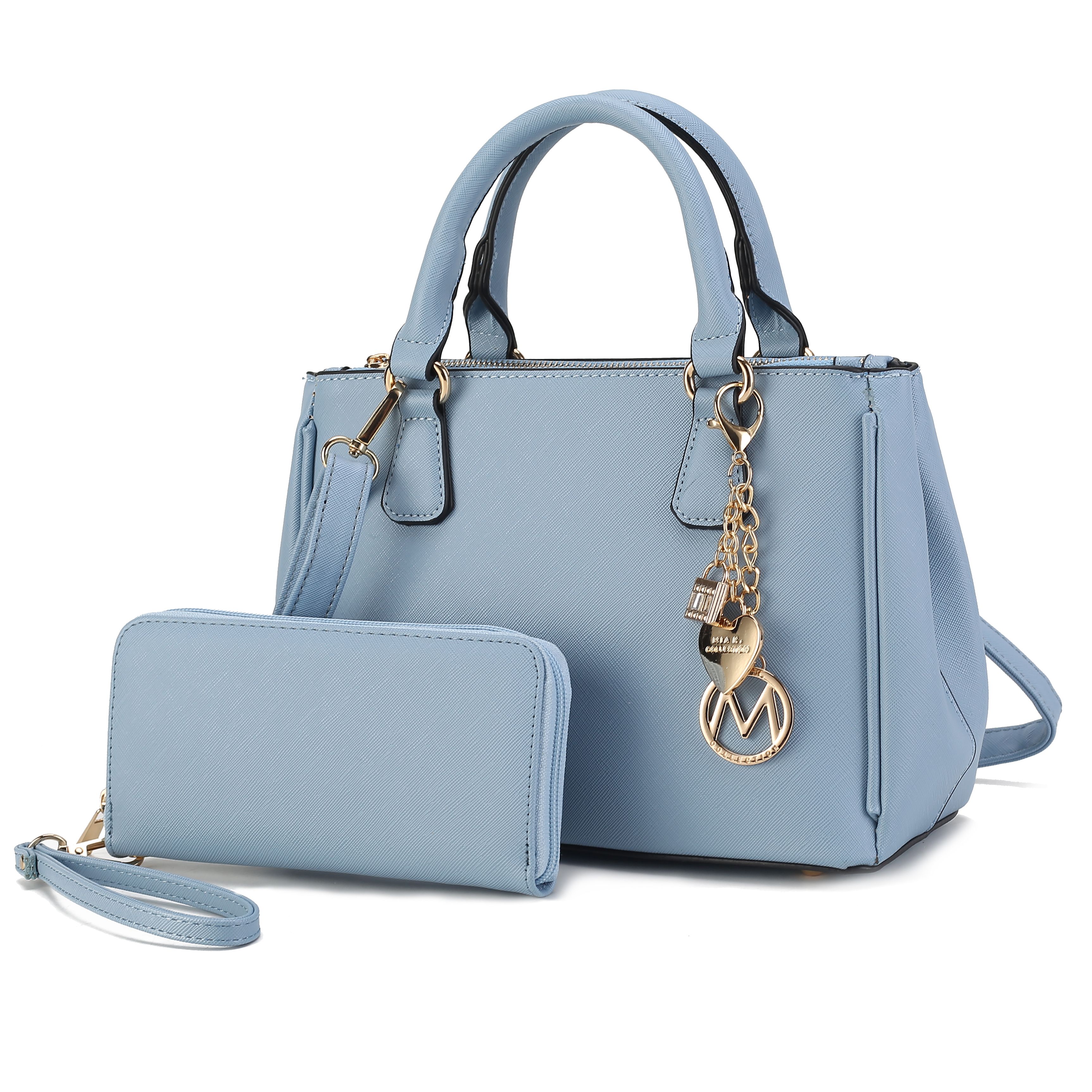 A light blue handbag with gold hardware and a matching wristlet wallet. The handbag features a charm with a heart and other decorative elements.