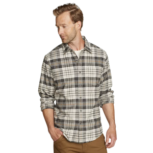 A man is wearing a plaid flannel shirt with long sleeves and a white undershirt, paired with brown pants.
