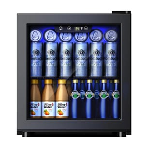 A compact fridge displays Krombacher Pils cans, Juicy Water bottles, and Perrier bottles, arranged on two shelves, with a digital temperature display at the top.