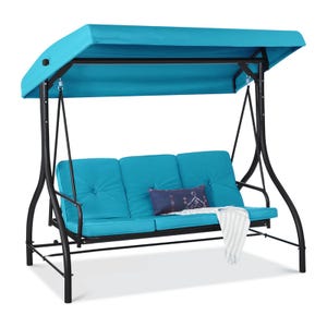 Three-seater outdoor swing with a turquoise canopy and cushions, featuring a black metal frame. Includes a decorative pillow and a draped striped throw blanket.