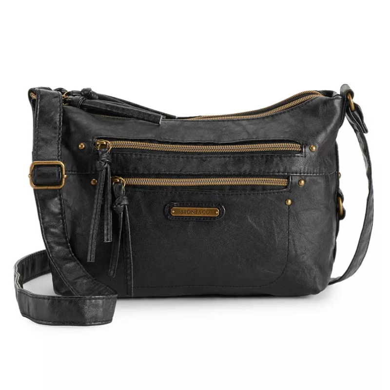 Black crossbody bag with gold zipper accents and adjustable strap, featuring multiple compartments and \“STONE & CO.\“ logo on the front.
