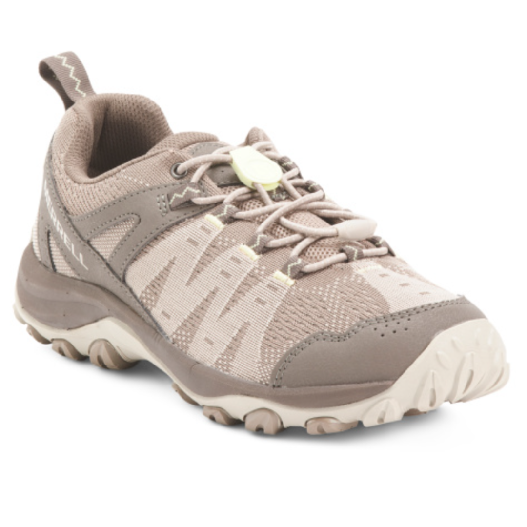A beige and light brown hiking shoe with a rugged sole, breathable mesh, and a toggle lace system.