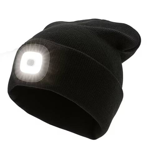 A black beanie with an integrated LED light on the front, designed to provide hands-free illumination for outdoor activities or low-light conditions.