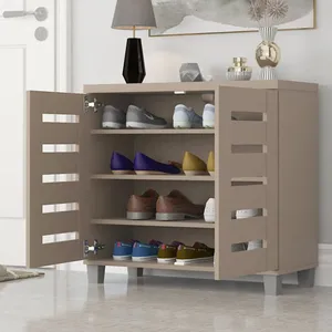 A beige shoe cabinet with multiple shelves displaying various pairs of shoes, located in a modern interior setting with decorative items on top.
