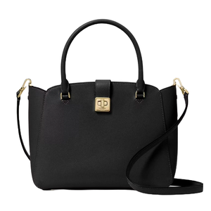 A black Kate Spade Phoebe Medium Satchel featuring dual handles, a detachable shoulder strap, and a gold-tone turn-lock closure on the front. The bag has a structured silhouette and subtle gold hardware accents.