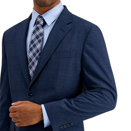 A man is shown wearing a dark blue suit with a subtle pattern, paired with a light blue shirt and a blue and white plaid tie.