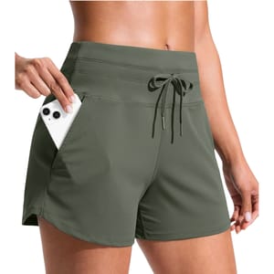 High-waisted olive green athletic shorts with a drawstring and a phone in the side pocket.