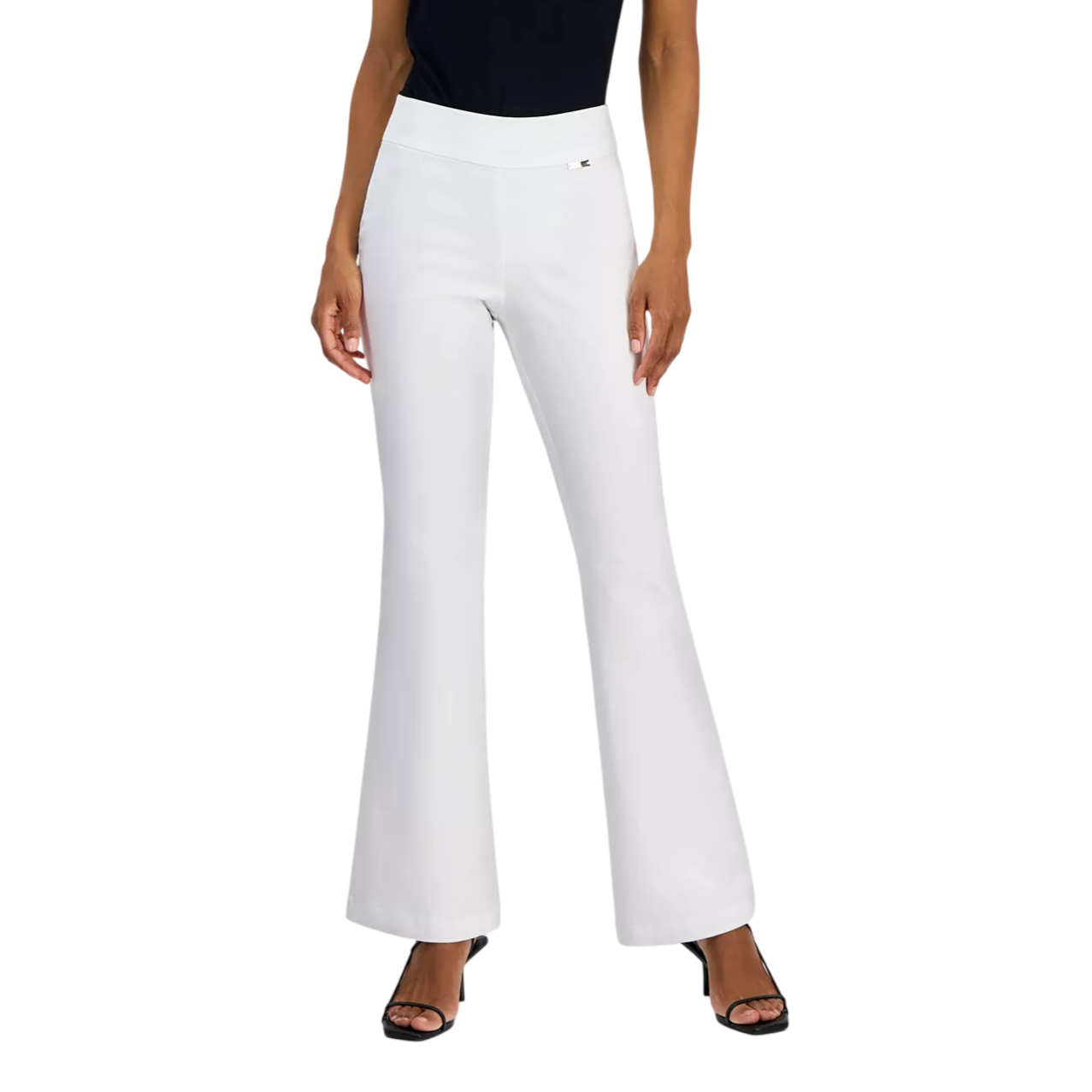 A woman is wearing a black short-sleeved top with a gathered detail at the bust, paired with high-waisted white flared pants and black heeled sandals.