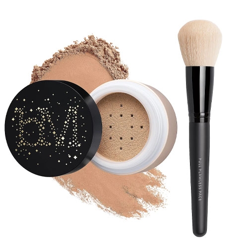 a powder foundation next to a fluffy brush