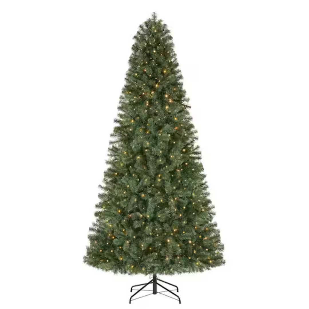 Artificial Christmas tree with built-in warm white lights, conical shape, and a metal stand.