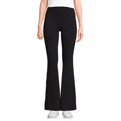 Black flared yoga pants paired with white sneakers, worn by a person standing against a plain background.