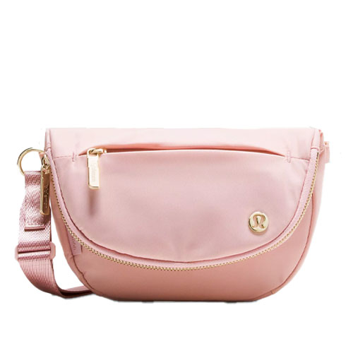 A pink shoulder bag with a gold zipper and logo, featuring a front pocket and a matching adjustable strap.
