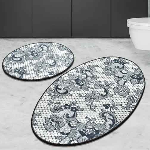 2-piece oval bathroom rug set with a decorative floral and paisley pattern on a mesh-like background, featuring dark outlines and shades of gray.