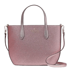 A shimmery pink tote bag with dual handles and a detachable shoulder strap, featuring a Kate Spade New York logo.