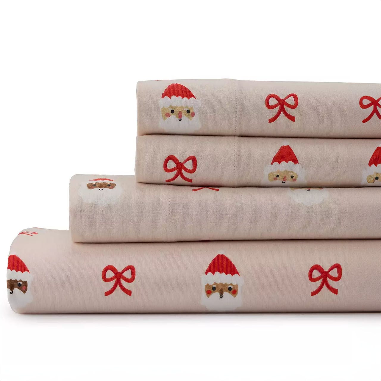 A stack of queen-sized sheets in a light pink color, featuring a festive pattern with Santa faces and red ribbons.