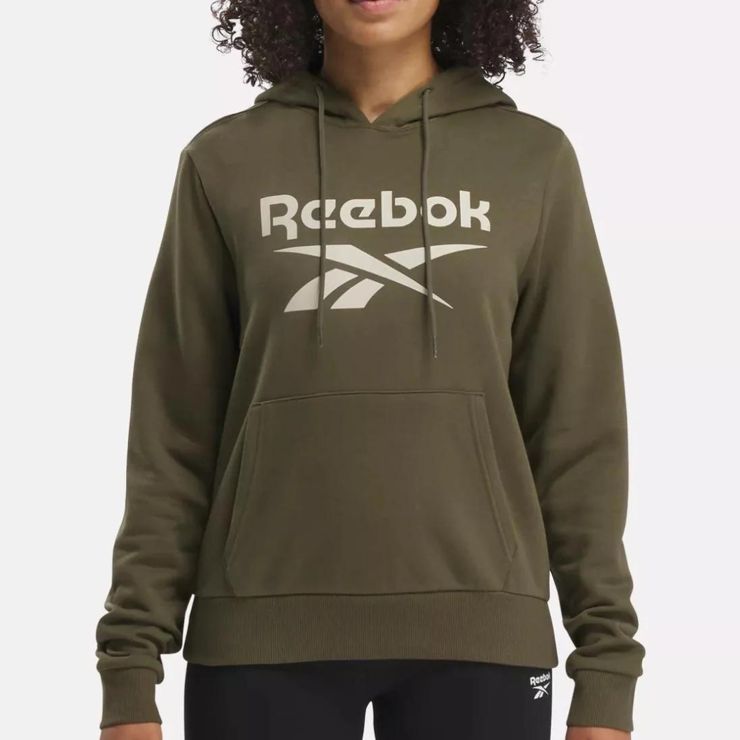A person wearing an olive green Reebok hoodie with the brand's logo on the front.