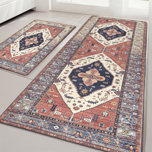 Two rectangular area rugs with intricate geometric and floral patterns in blue, red, and cream tones are placed on a light-colored floor.