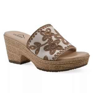 Beige wedge sandal with floral embroidery and a woven platform heel.