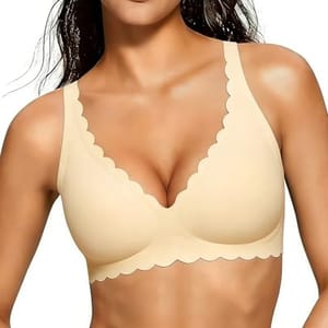 A beige bra with scalloped edges and wide straps, offering a seamless design and light support.