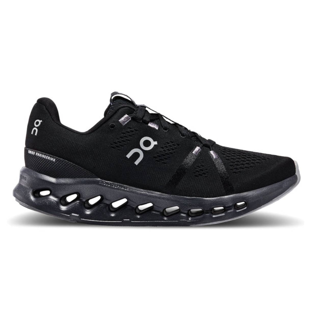 Black athletic shoe with a distinctive cut-out sole design and minimalist branding details.