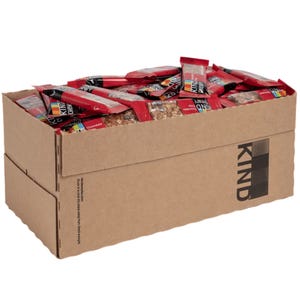 Box of KIND granola bars with a red and black design. Bars are individually wrapped, filling the box.