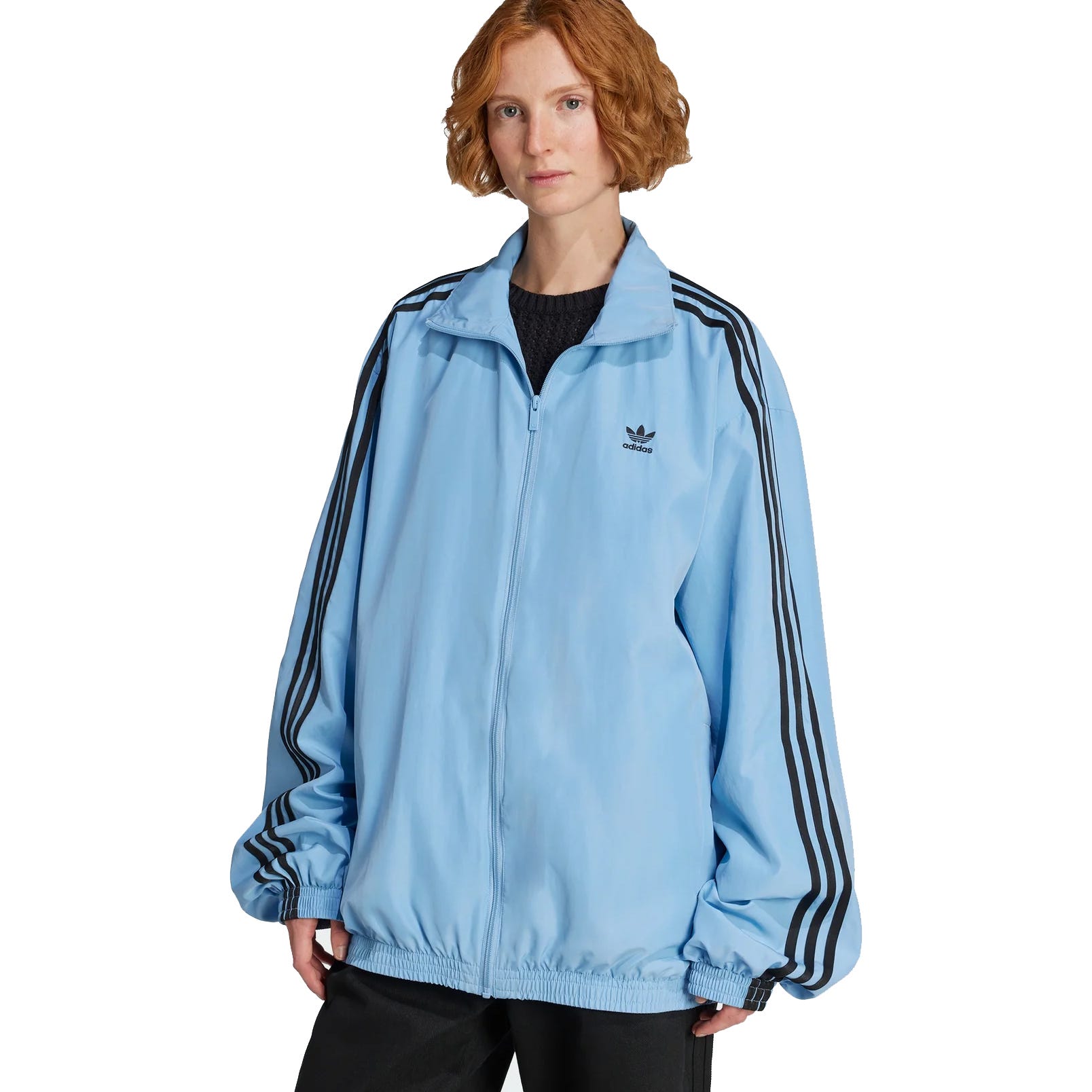 Light blue Adidas track jacket with black stripes on the sleeves, featuring the Adidas Trefoil logo on the chest.