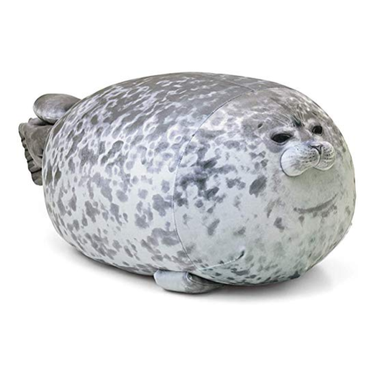 A round, grey seal plush toy with a spotted pattern, resembling a realistic seal.