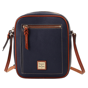 The Dooney Pebble Leather Crossbody is a compact, navy blue bag with contrast stitching and brown leather accents. It features a front zip pocket, adjustable strap, and a Dooney & Bourke logo patch on the front.