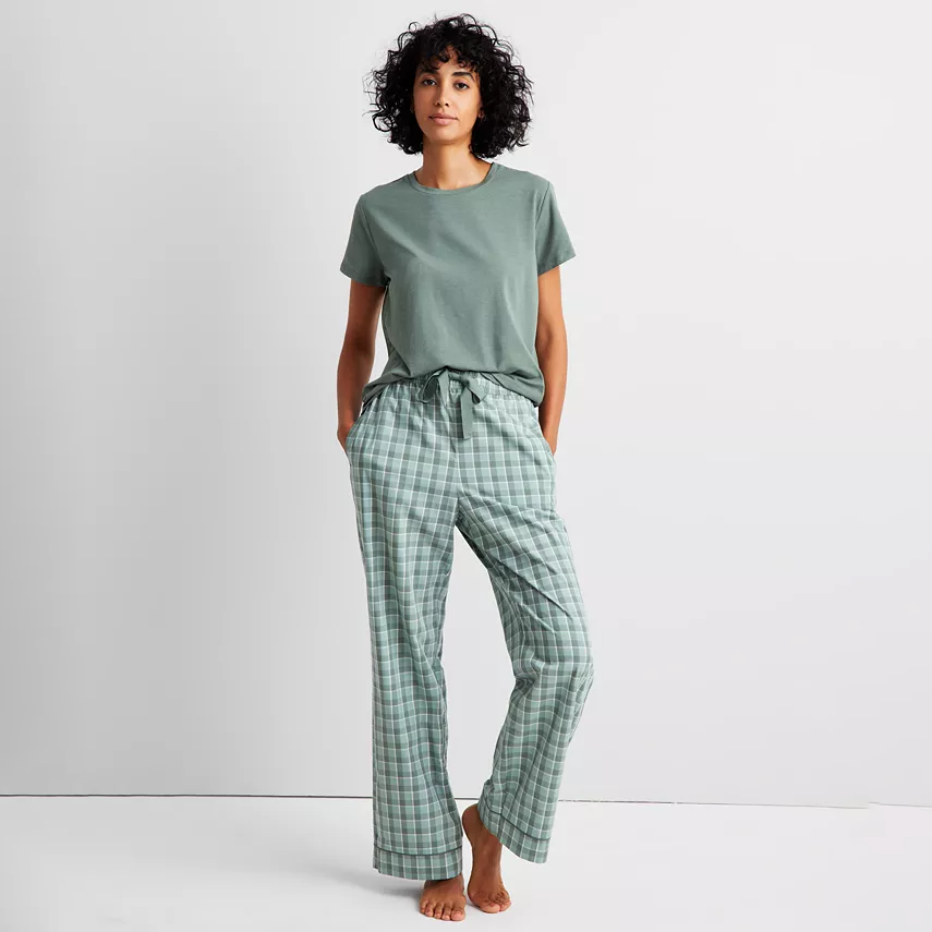 Plaid pajama pants with a drawstring waist, featuring a green and white checkered pattern.