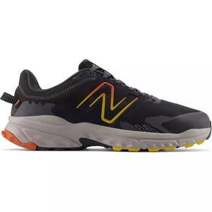 A black and gray New Balance sneaker with a yellow and orange accent on the logo.