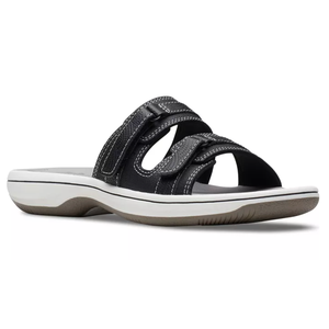 Black sandal with white stitching, two adjustable straps, and a cushioned rubber sole with a white and gray color scheme.