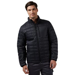 A man wearing a black quilted jacket with a front zipper, featuring a stand-up collar and a zippered chest pocket.