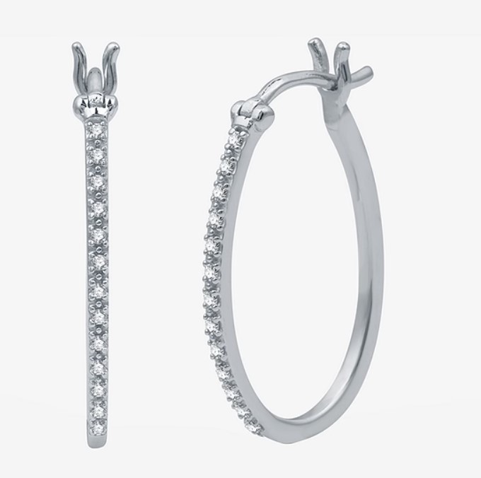A pair of silver hoop earrings with a line of small diamonds on the front side.
