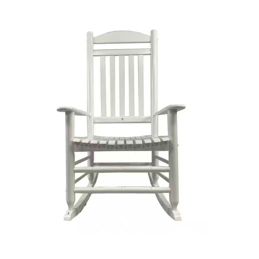 White wooden outdoor rocking chair with a slatted back and seat, armrests, and curved rockers. Simple and classic design suitable for relaxing on a porch or patio.