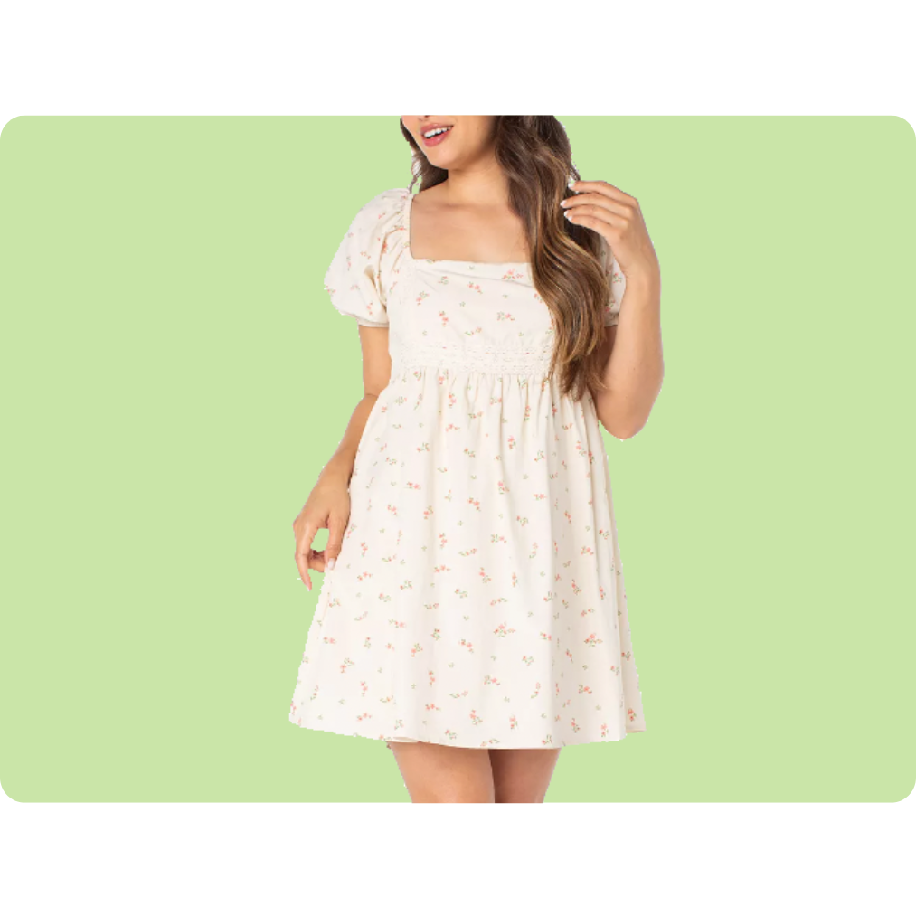 A light-colored, floral-patterned short dress features puff sleeves and a square neckline against a green background.