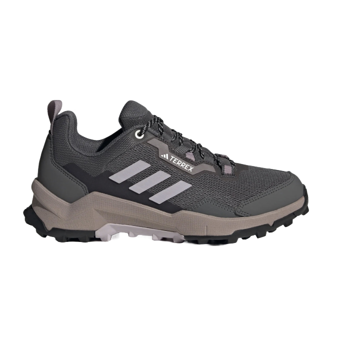 Adidas Terrex hiking shoe in dark gray with a rugged, textured sole, featuring the Adidas logo and three stripes on the side.