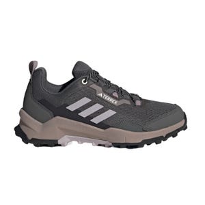 Adidas Terrex hiking shoe in dark gray with a rugged, textured sole, featuring the Adidas logo and three stripes on the side.