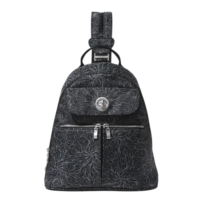A black sling backpack with a floral pattern, featuring a front flap pocket with a twist lock, a main zipper compartment, and a single adjustable strap.